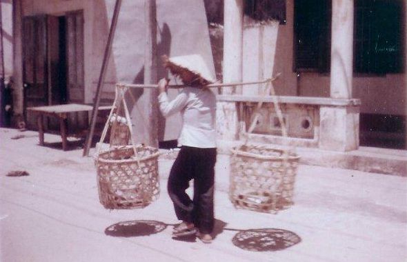 woman carrying Chogie stick
