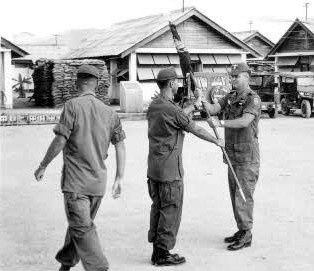 On 15 February 1966 before assembled elements of all units of the 14th Aviation Battalion, Lt Col Joseph P. Smith relinquished the Battalion colors to Major Ronald J. Rogers. In a following ceremony (L to R) Maj. Paul Walker, Maj. Ron J. Rogers and Maj. Russ Edwards, change of command ceremony,18th Aviation Company On 15 February 1966 before assembled elements of all units of the 14th Aviation Battalion, Lt Col Joseph P. Smith relinquished the Battalion colors to Major Ronald J. Rogers. In a following ceremony (L to R) Maj. Paul Walker, Maj. Ron J. Rogers and Maj. Russ Edwards, change of command ceremony,18th Aviation Company