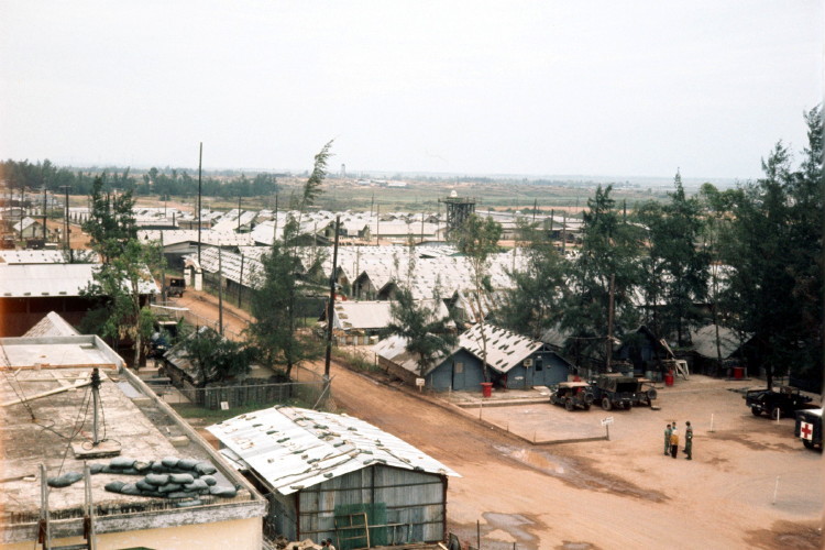 Shot take from near the control tower by Pat Snyder. In this photo, Dennis Currie and Don Ricks walked into the Med area about where the most lower right vehicle sits with a red cross on it. Shot take from near the control tower by Pat Snyder. In this photo, Dennis Currie and Don Ricks walked into the Med area about where the most lower right vehicle sits with a red cross on it.