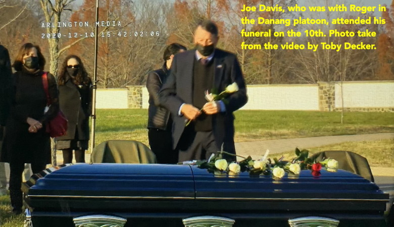 Joe Davis, Catkiller 30, placing a rose on Roger Putnam's casket Joe Davis, Catkiller 30, placing a rose on Roger Putnam's casket