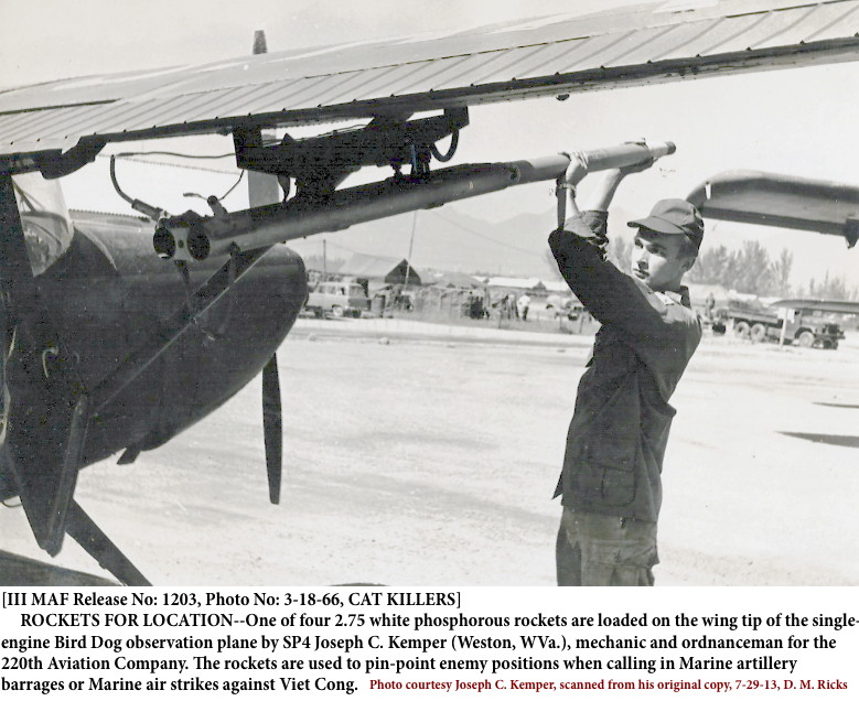 SP4 Joseph Clark Kemper loading a 2.75 on a mission Birddog before departure SP4 Joseph Clark Kemper loading a 2.75 on a mission Birddog before departure