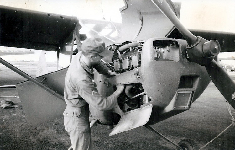 Joe Kemper replacing a spark plug on a 1st Platoon aircraft, 57-8223, while at Hue Joe Kemper replacing a spark plug on a 1st Platoon aircraft, 57-8223, while at Hue