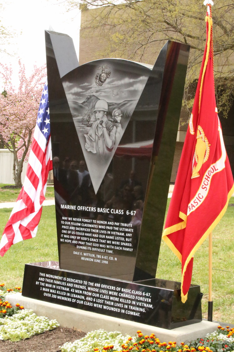 The 6-67 Memorial sits between the U.S. flag and the Marine Corps flag during the memorial’s dedication at The Basic School on April 25, 2014 The 6-67 Memorial sits between the U.S. flag and the Marine Corps flag during the memorial’s dedication at The Basic School on April 25, 2014