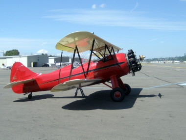 Gene and Ellie Wilson ride in a Bi-Plane